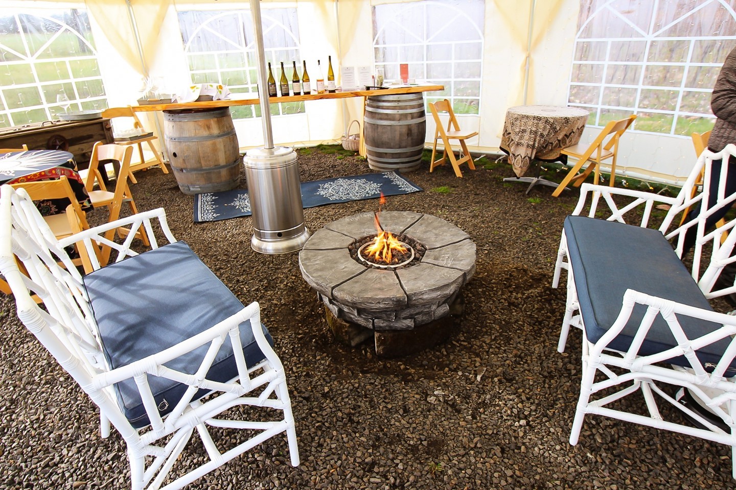 Fire pit and couches in the outdoor tasting tent